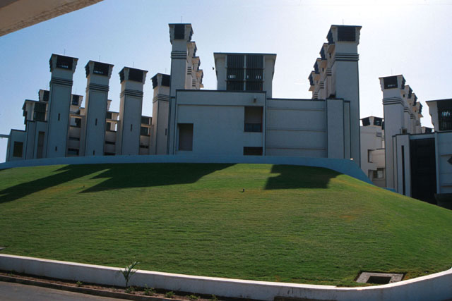 Exterior view showing intake towers on the roof and exhaust towers on the periphery of the building