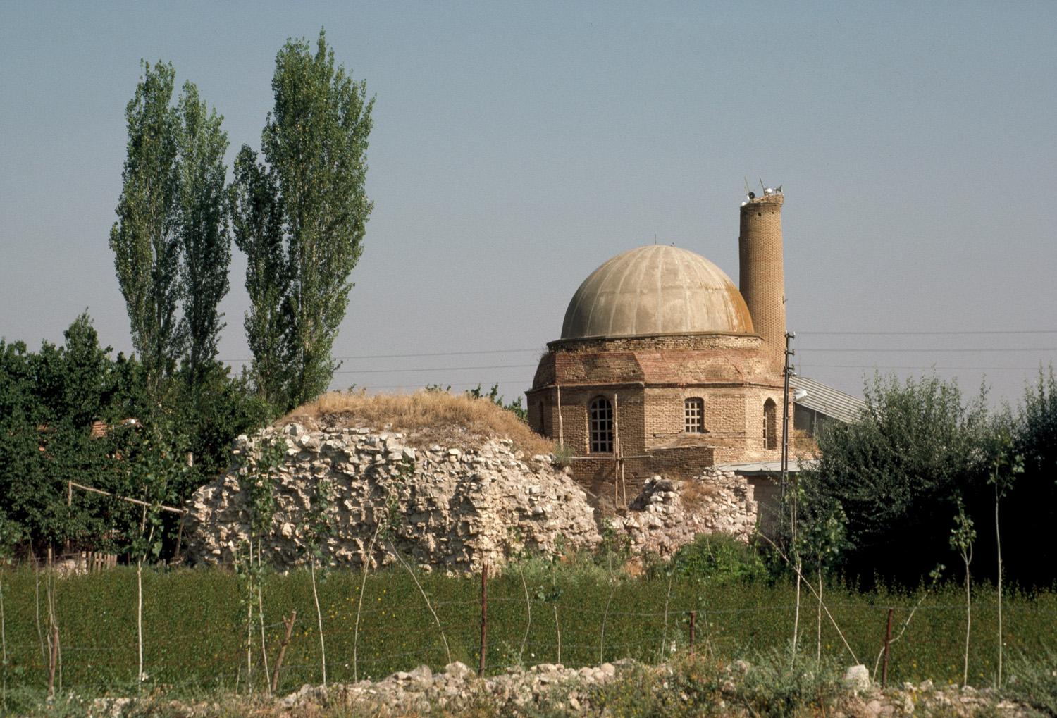Exterior view from south, showing sanctuary dome and minaret