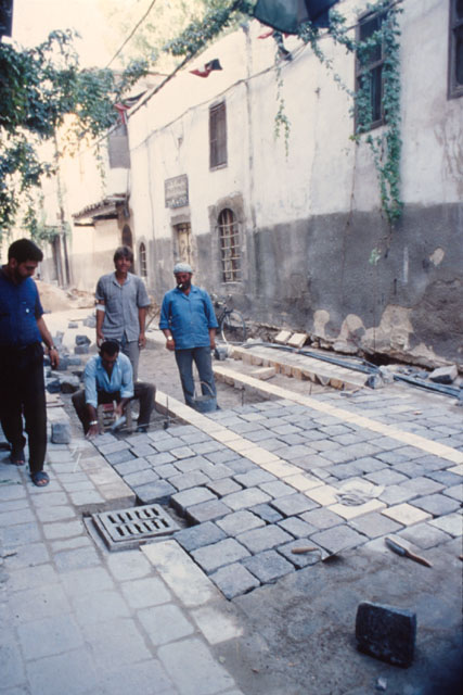 Exterior view showing laying of stone-block paving