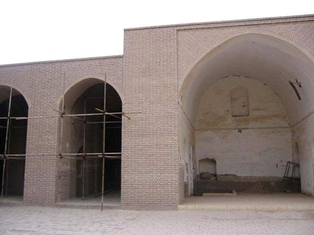 Exterior view from within the courtyard of mosque prior to the earthquake, showing the arched openings undergoing renovation work