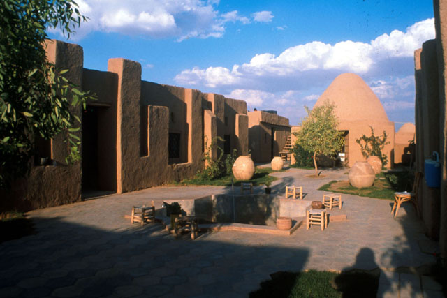Exterior view of courtyard centered around star shaped fountain