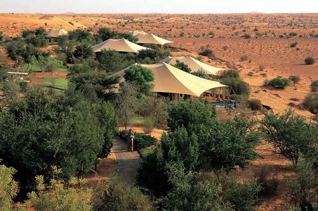 General view, tent-roofed suites in oasis