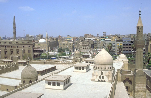 View over roof of prayer hall of al-Azhar. The dome and lantern vault of Jawhariyya Madrasa are visible at the center of the photograph, near the mosque's north wall.
