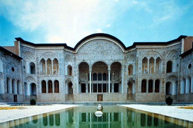 Exterior view after reconstruction from courtyard showing reflecting pool and view to discreet resting places