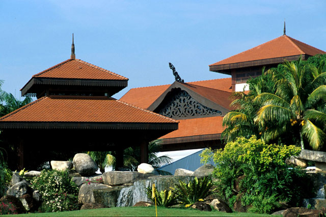 Exterior view, showing gardens and roofs