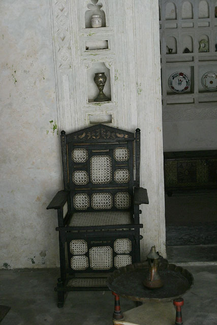 Front view of nineteeth century Swahili chair crafted from  African ebony inlaid with bone and ivory,