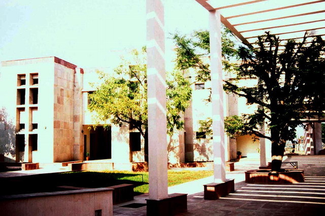 View of shaded arcade and landscaped courtyard
