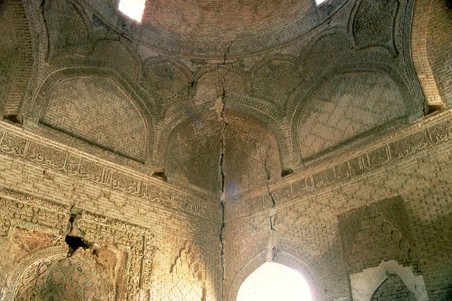 Interior view of qibla wall looking up to the mihrab hood and the squinches supporting the dome