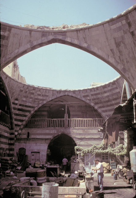 Northern view showing open court, the fountain and striations of stone that form the vaulted structure