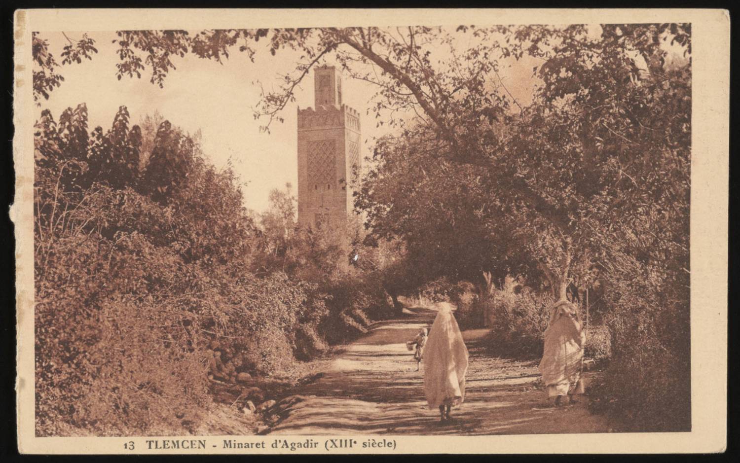 View of a pedestrian walking toward the Minaret of Agadir in Tlemcen (13th century)<br>
