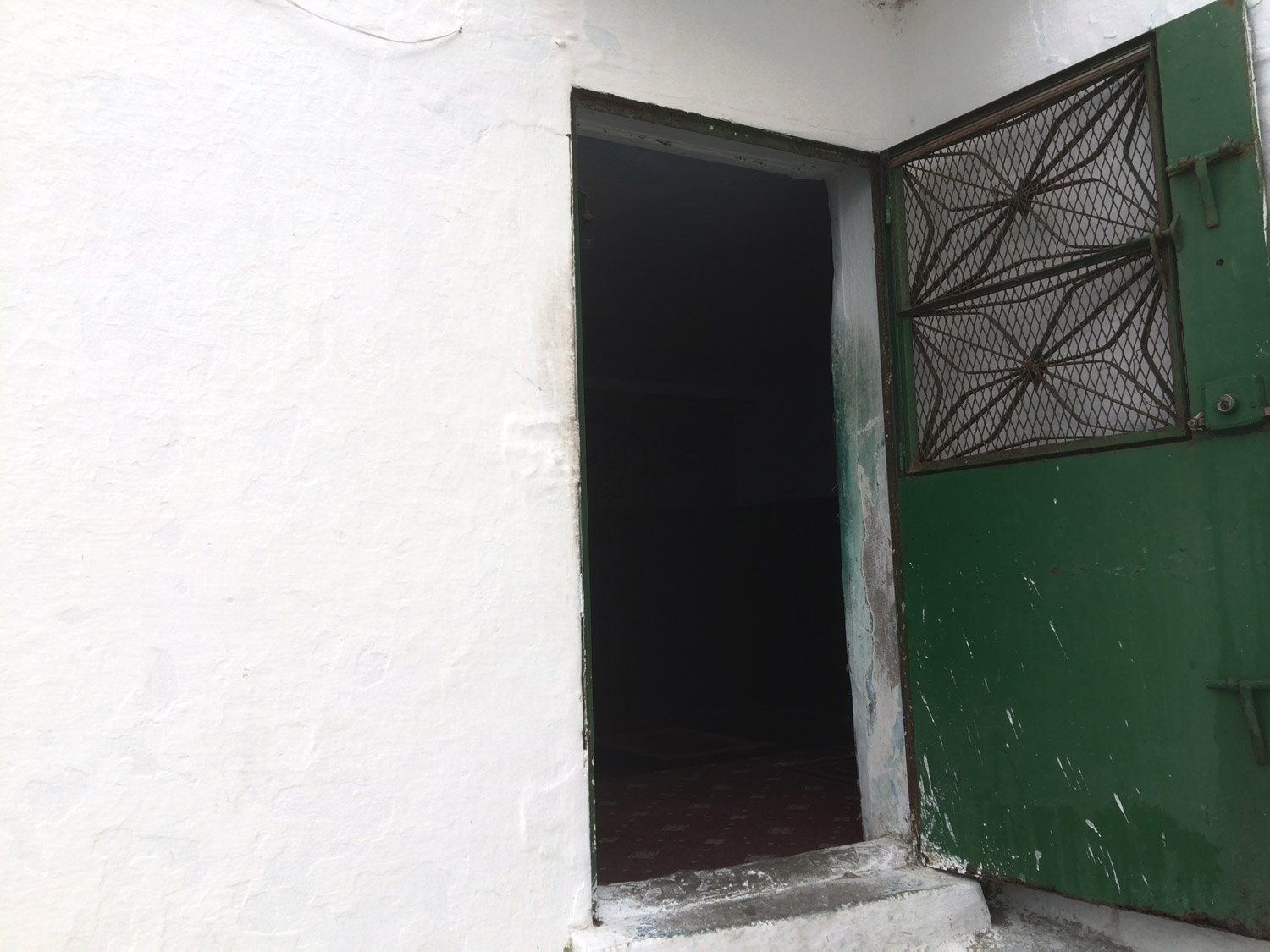 View of the open door to a small structure near the entrance