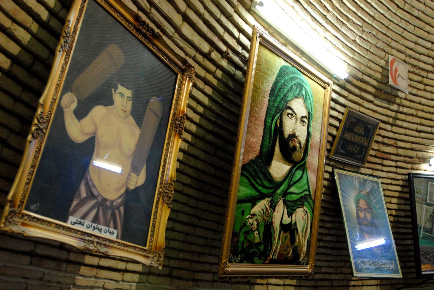 (Figure 14.7b, p. 370): Portraits of Ghulamreza Takhtii (left) and Imams ‘Ali (center) and Hussein (right)