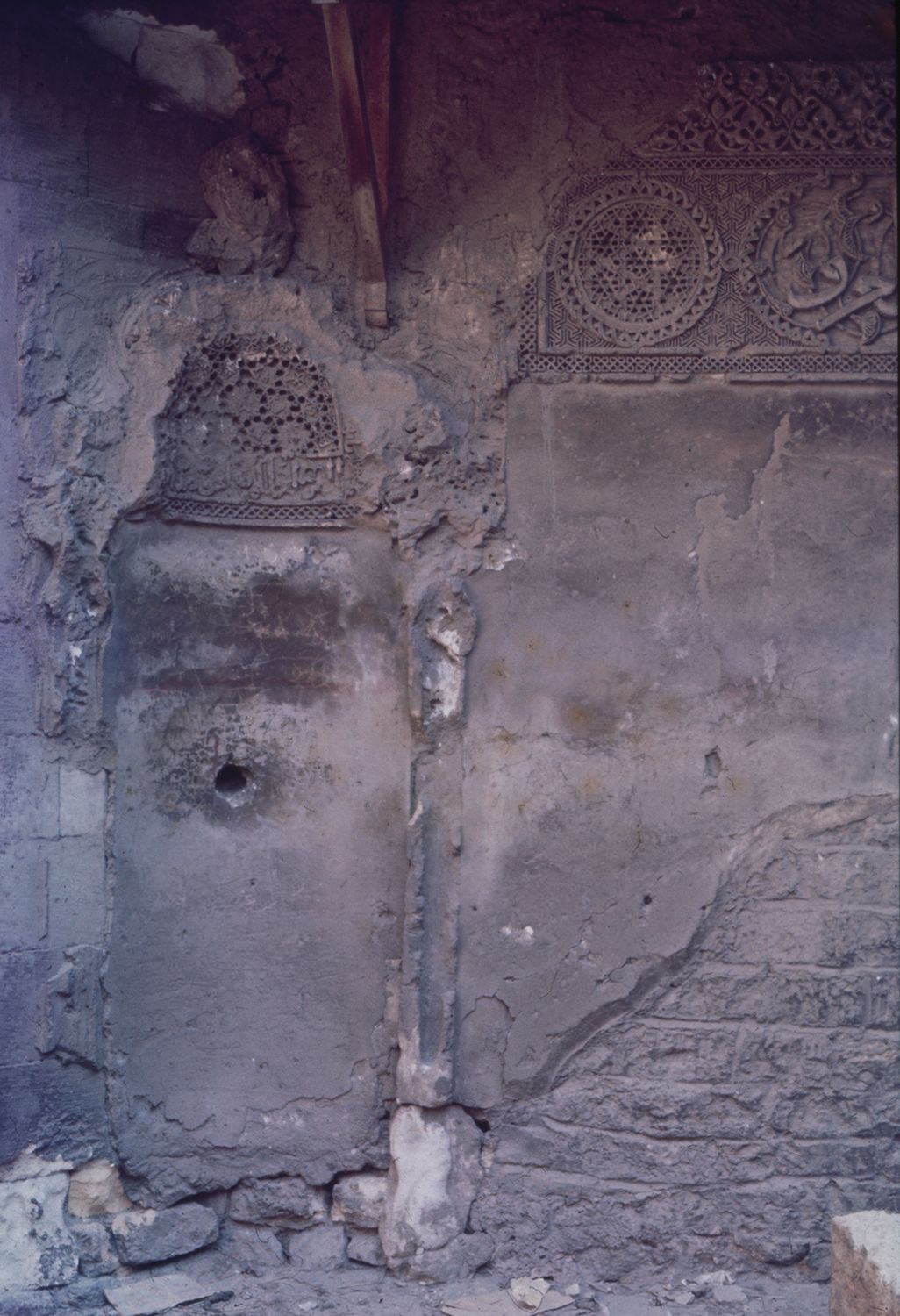 <p>Courtyard: view of stucco mihrab.</p>