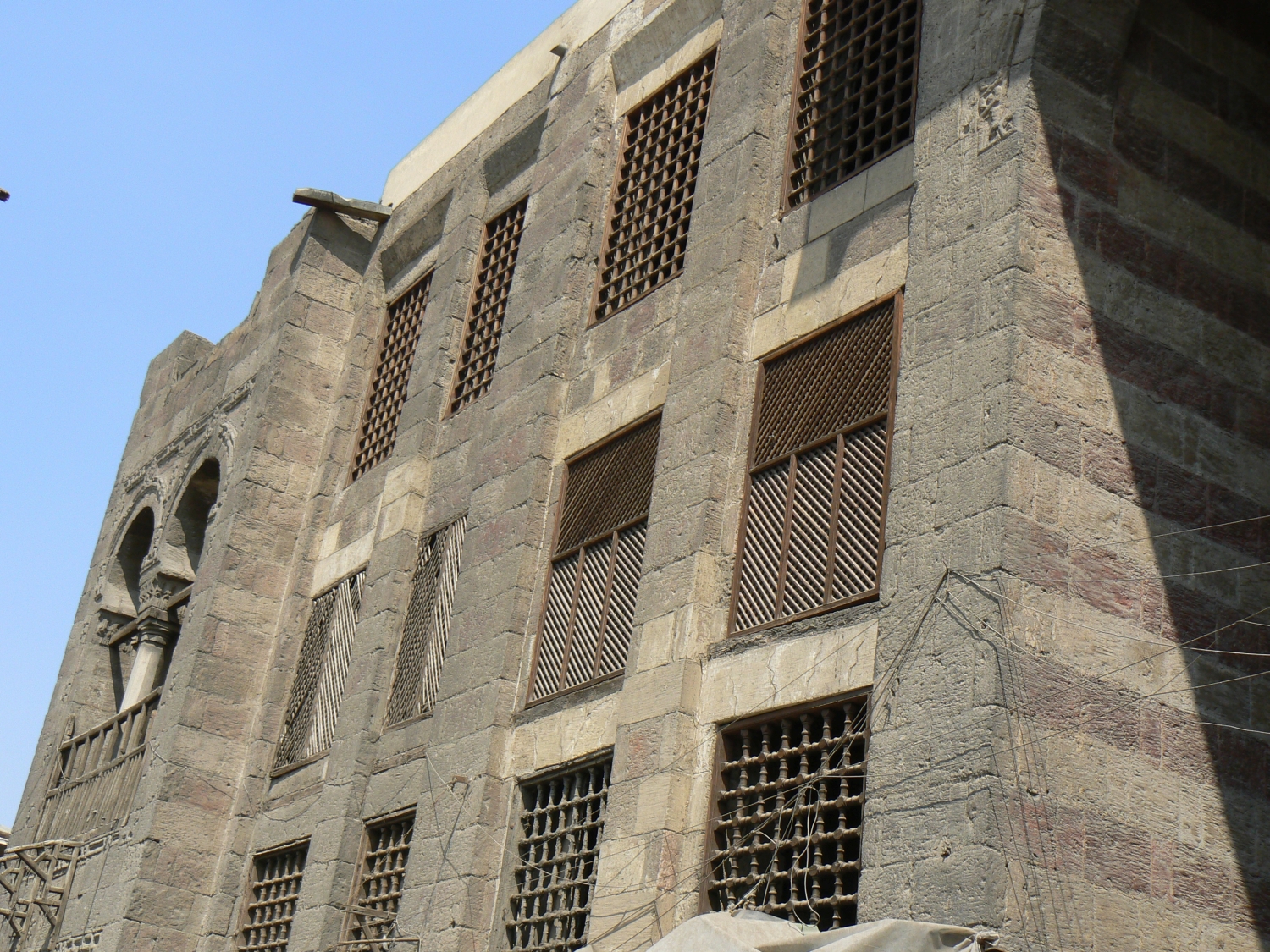 Grille and lattice windows on the front façade