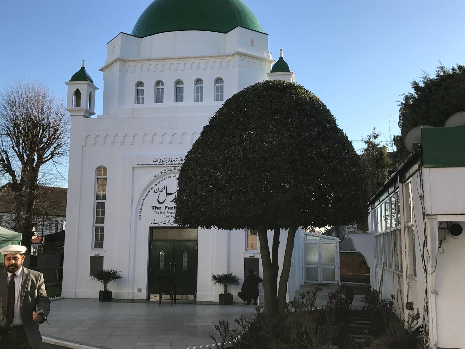 Fazl Mosque - View of the main entrance past ornamental trees