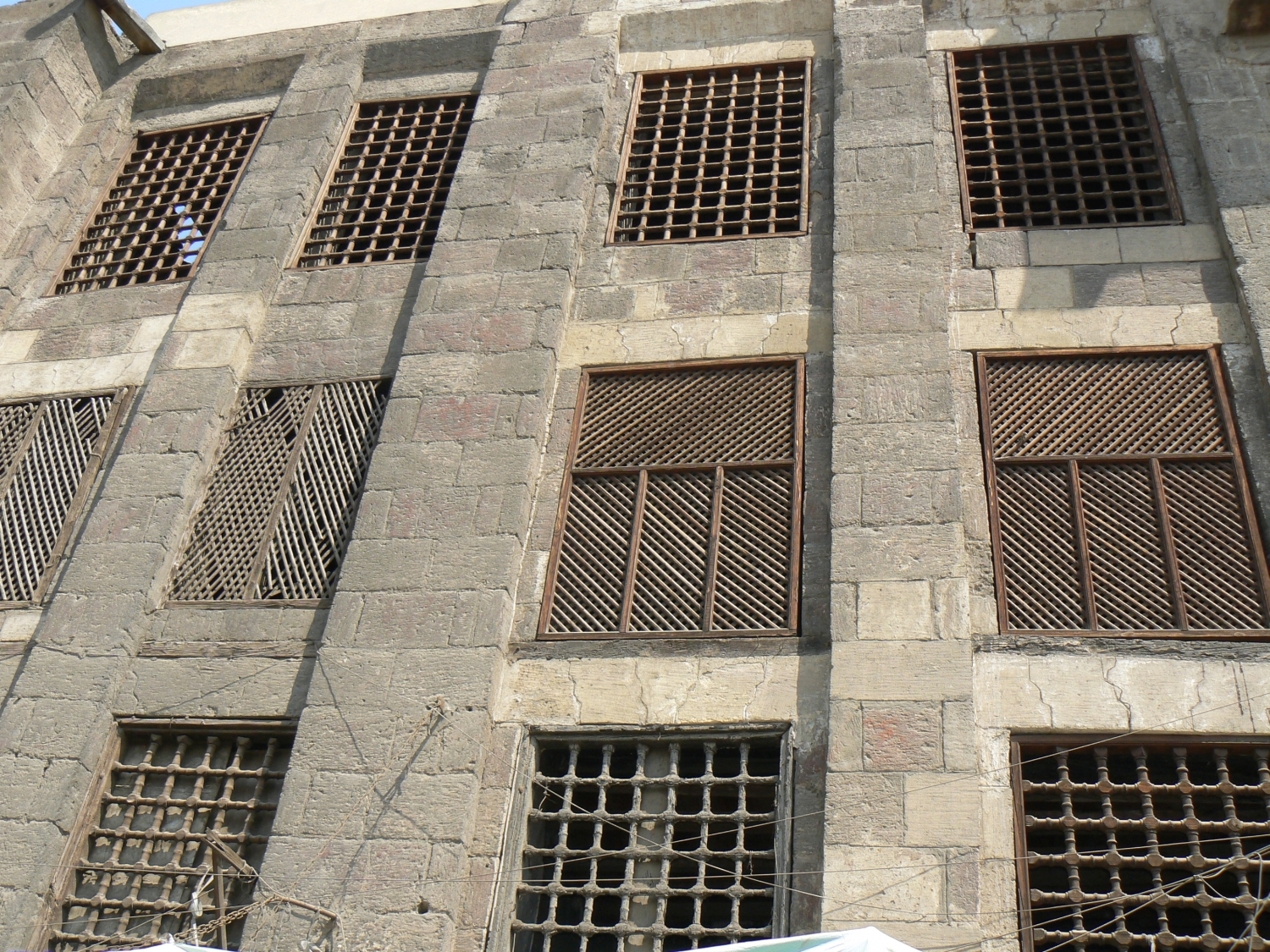 Grille and lattice windows on the front façade