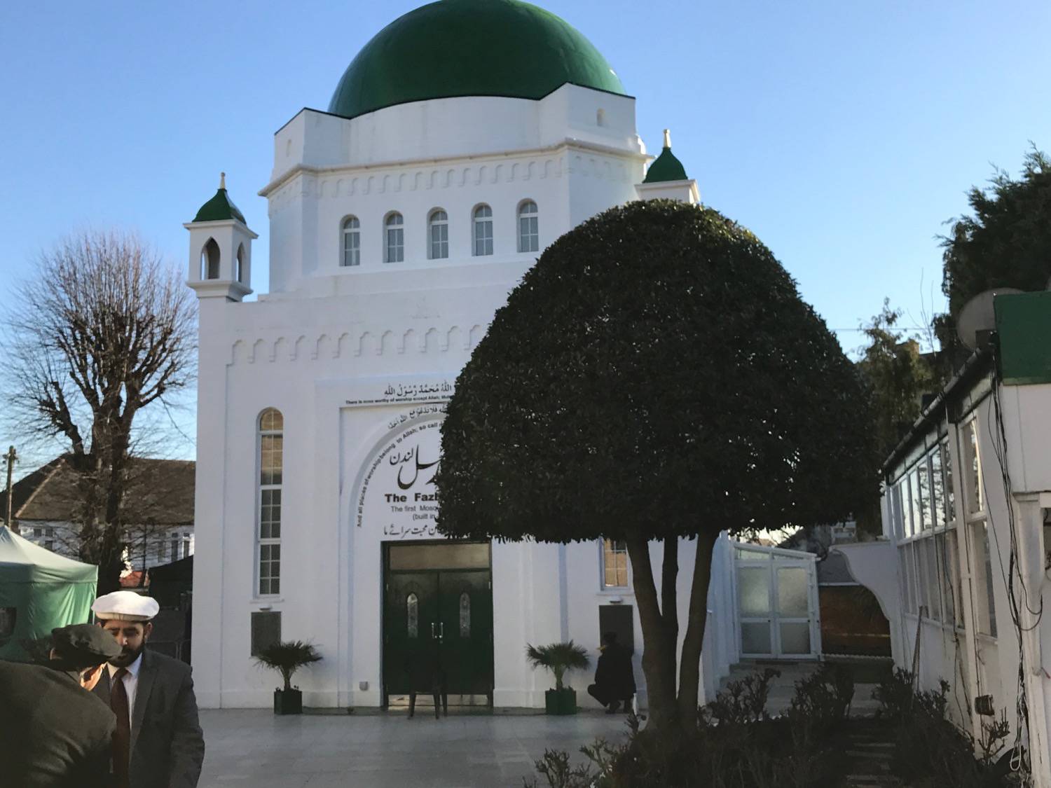 Fazl Mosque - View of the main entrance past ornamental trees