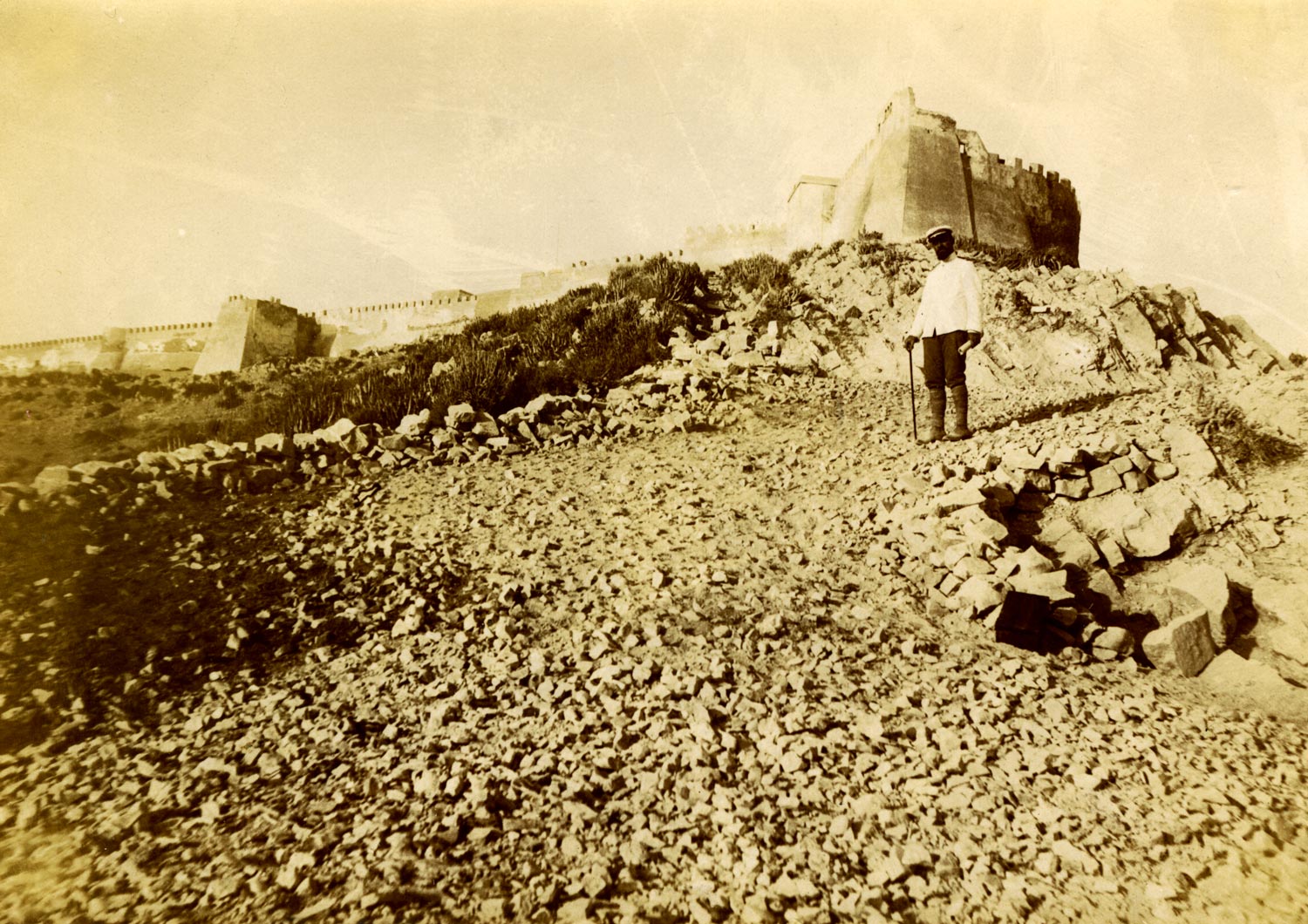 Man coming down from the Kasba on a rocky hill