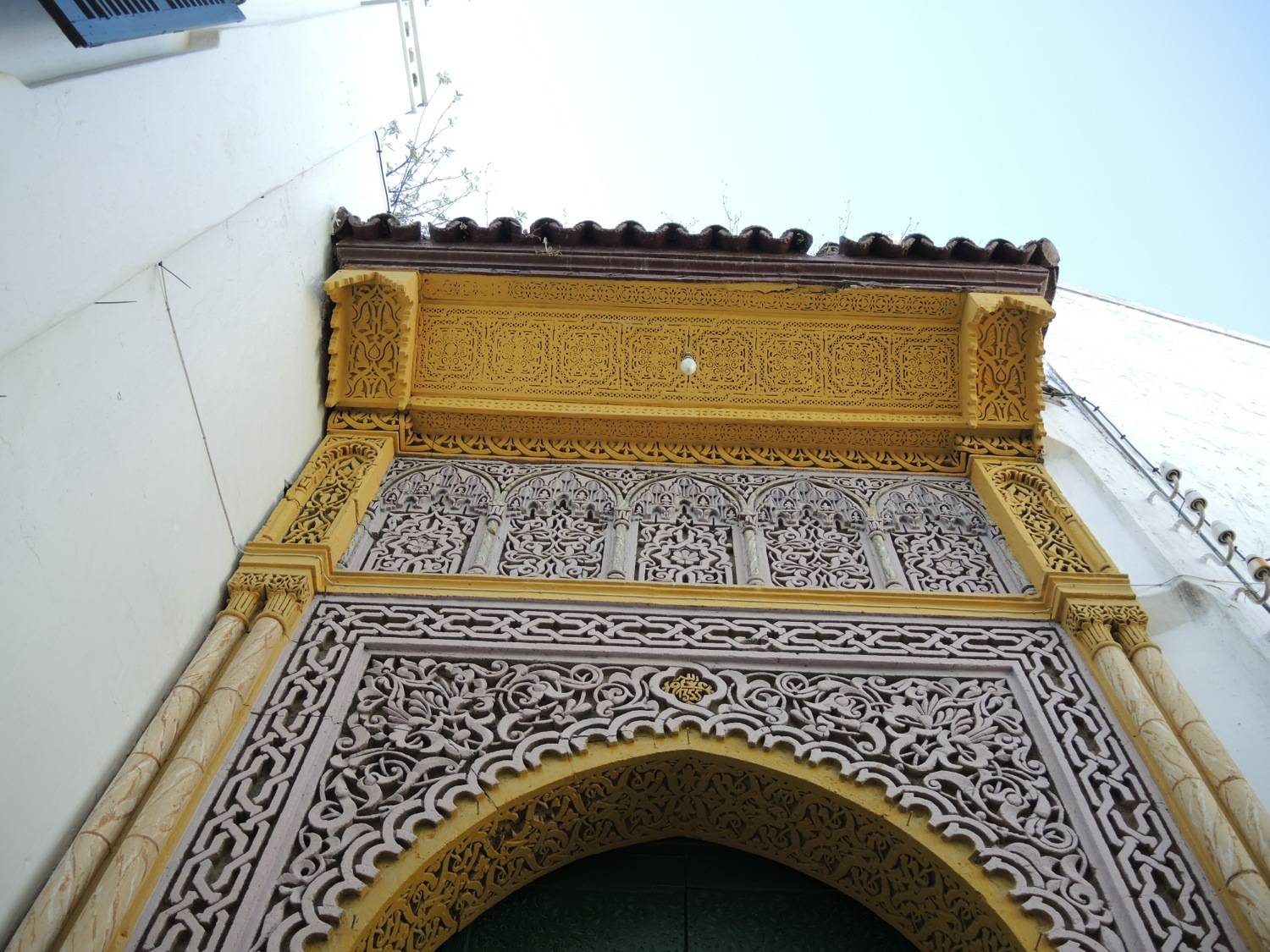 Detail view of the stucco decoration at the top of the main portal