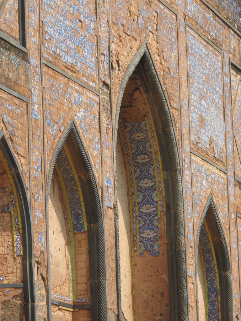 Detail of exterior elevation, showing arches and remains of tilework on intrados