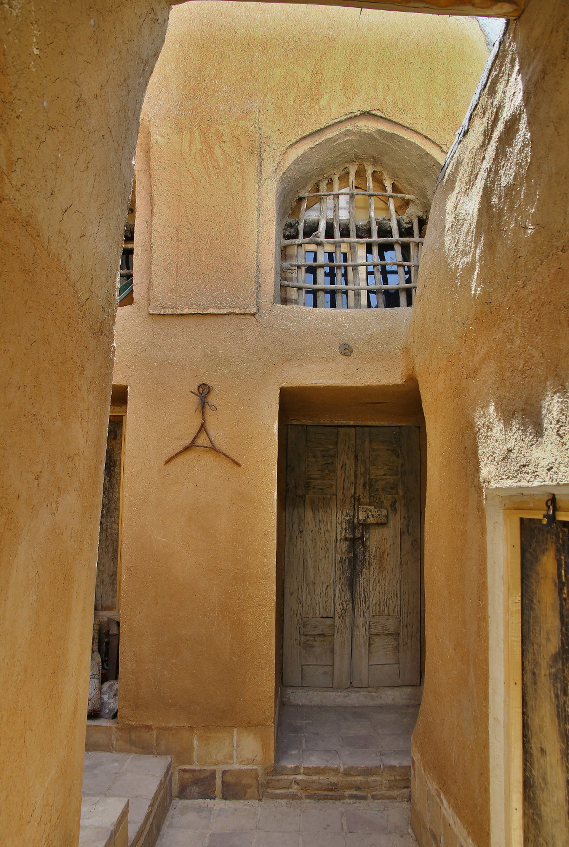 <p>Main entrance, an old wooden door </p>