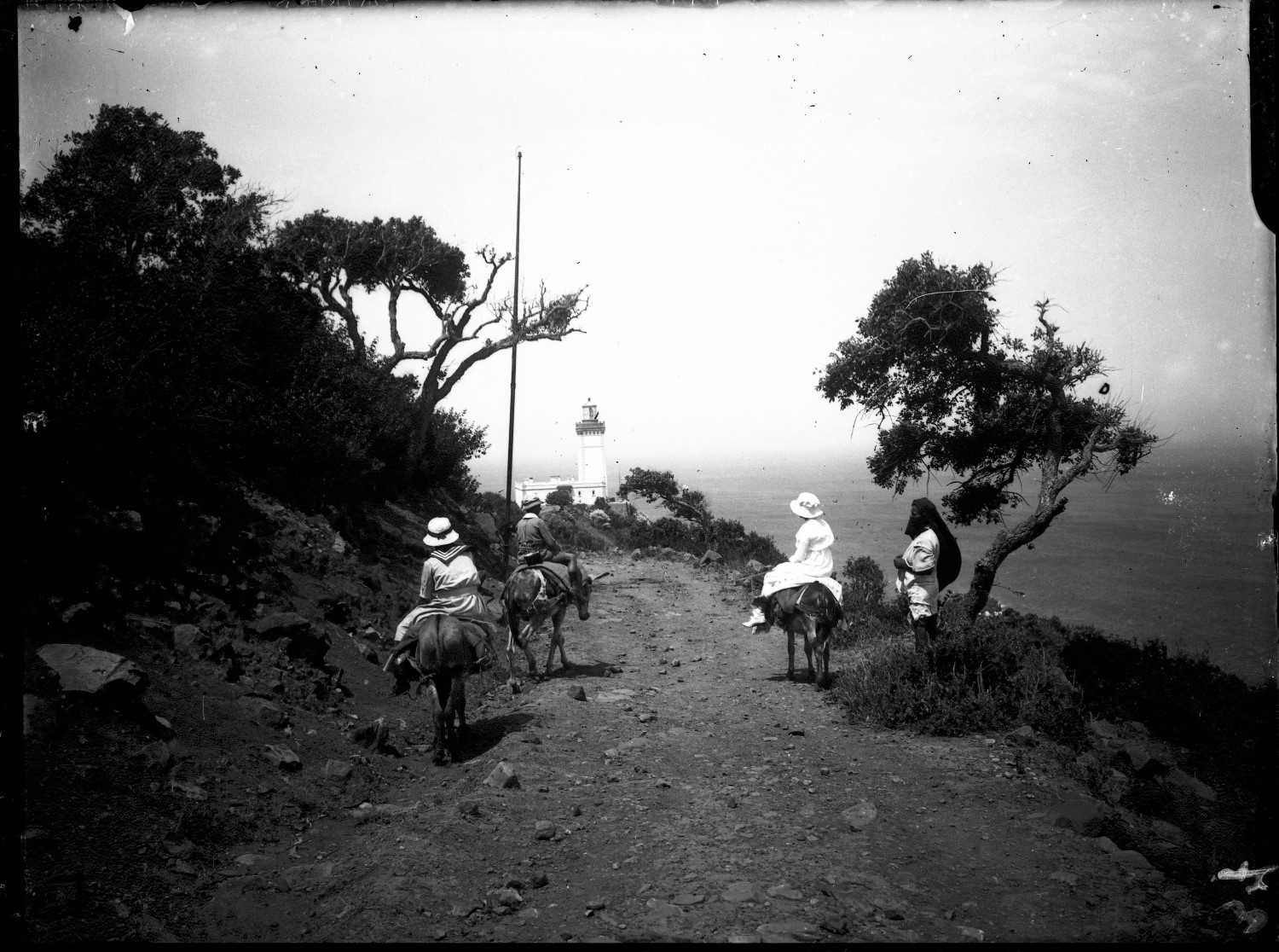 Women on donkeys on the road to Cap Spartel Lighthouse