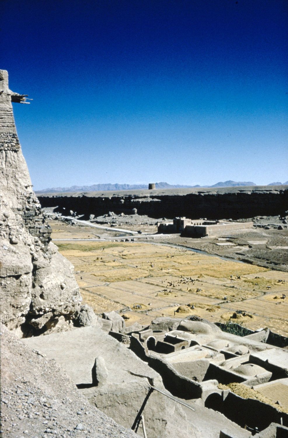 View from citadel of Izadkhvast looking northeast over river valley. The caravanserai of Izadkhvast is visible in background.