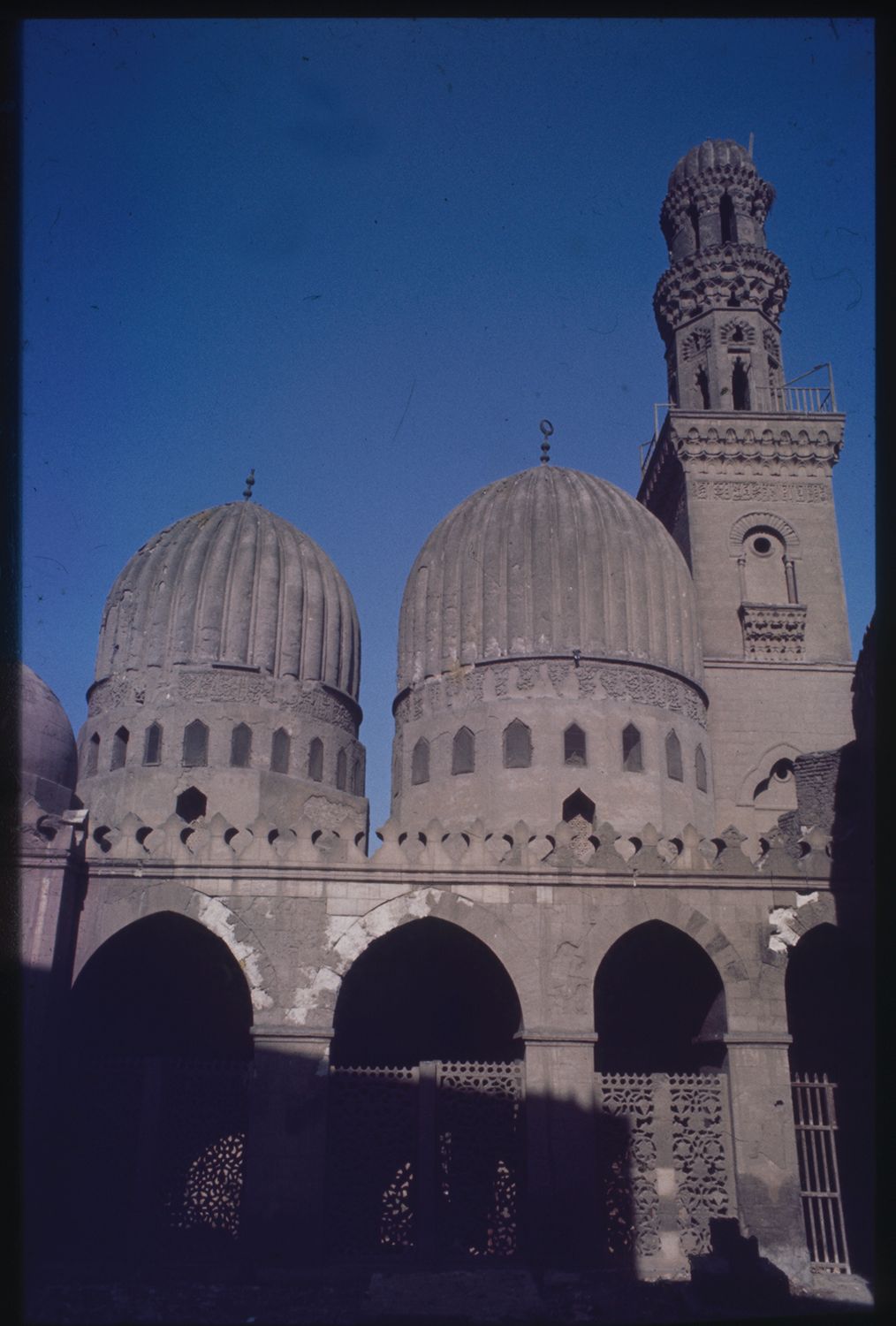 <p>Courtyard: view toward domes and minaret.</p>