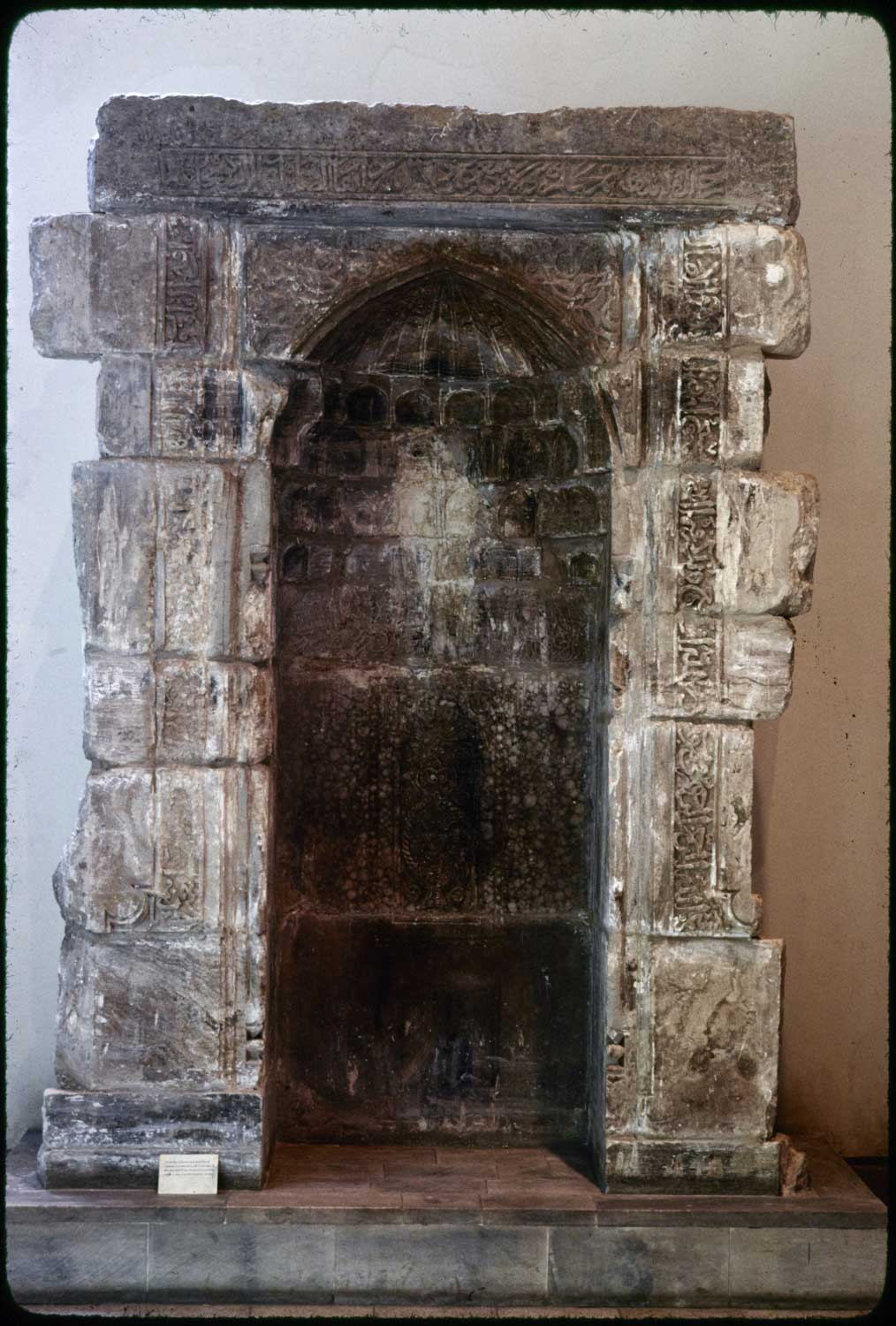 Marble mihrab from the mosque, displayed in a museum.