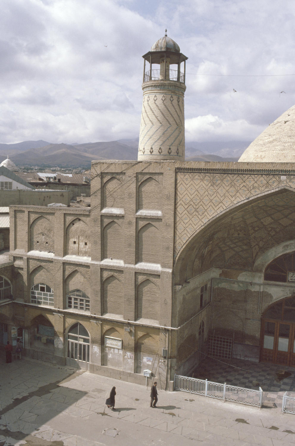 View toward qibla iwan, showing one of the minarets.