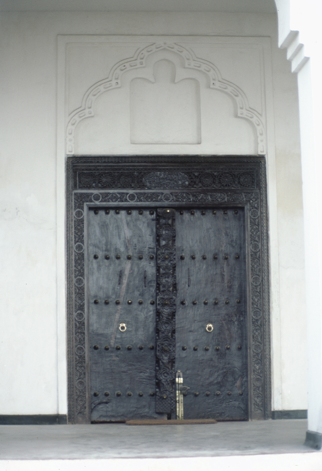 Detail of Omani-style carved wood entrance door