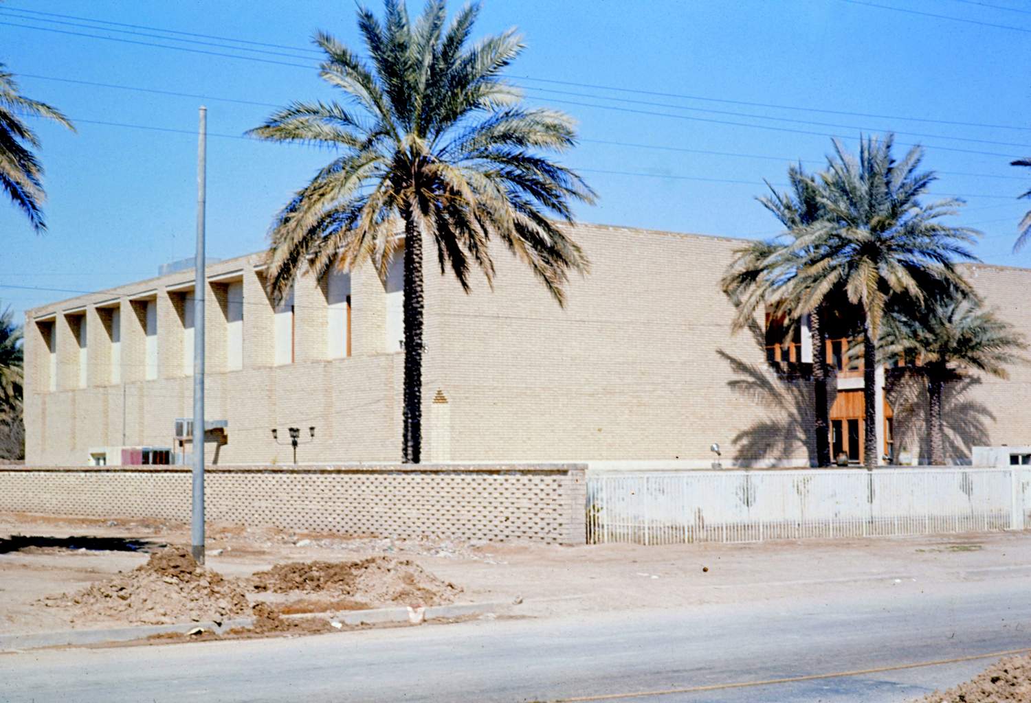 <p>View of south corner, showing entrance facade and southwest side of building.</p>