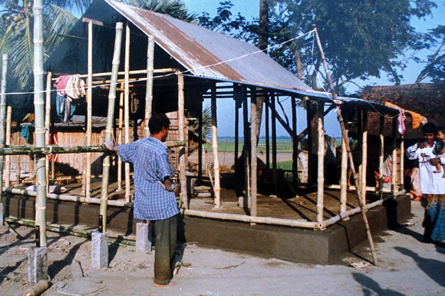 Participatory Action Research Project - Demonstration house 2, during reconstruction; plinth is rebuilt with cement stabilized mud