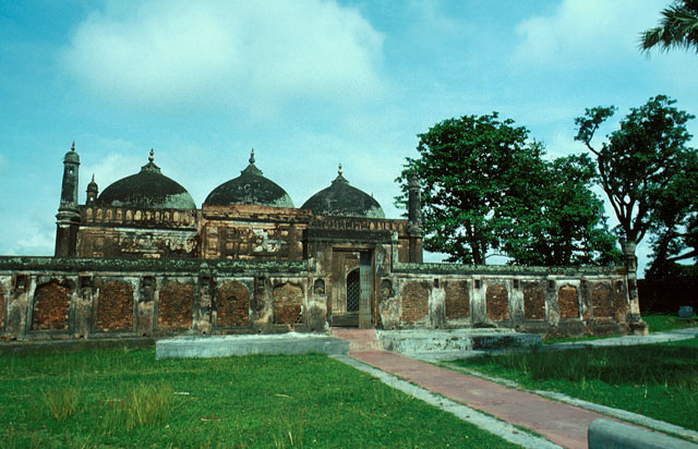 Mosque visible behind boundary wall