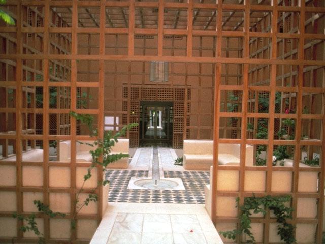 Latticework pergolas are used in private courtyards throughout the building