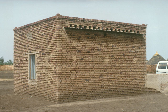 Exterior view showing brick structure with inserted eaves