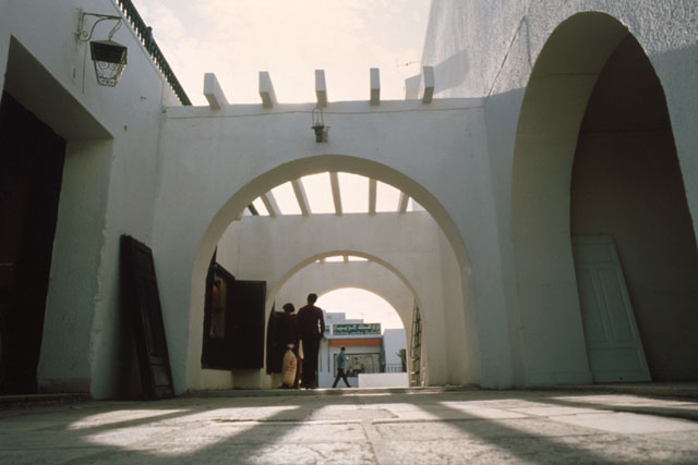 View form ground through series of arches that frame walkway
