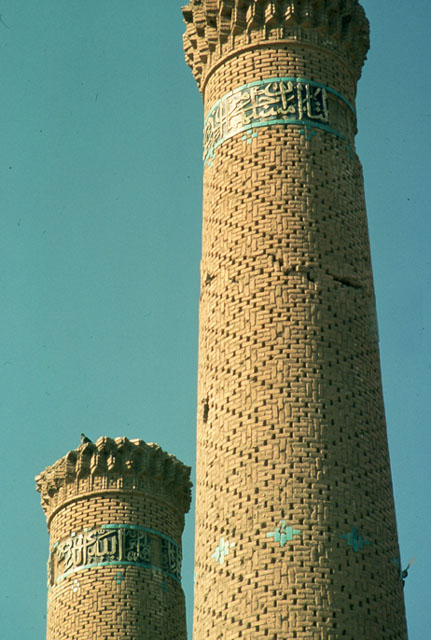 Detail of minarets showing brickwork and tile inscriptive bands