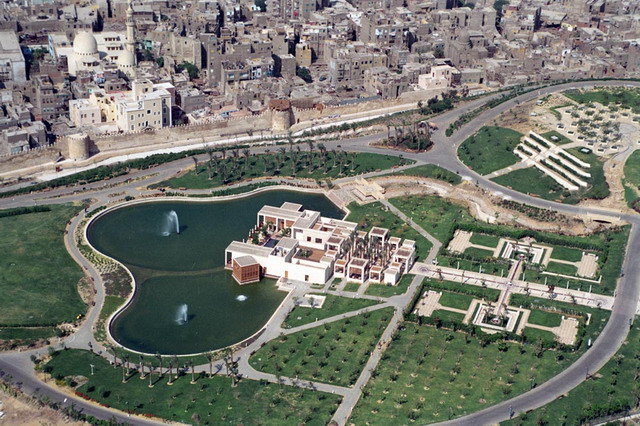 Lakeside Café - Aerial view of park looking west at the artificial lake and Lakeside Café, with Darb al-Ahmar neighborhood seen behind the Ayyubid city wall in the background