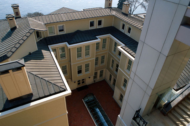 Exterior view showing horseshoe design around courtyard with elevator