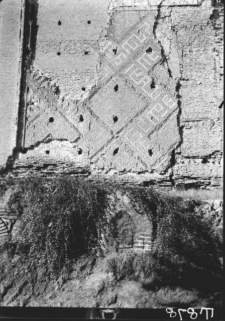 Diagonal tile patterns along portal arch's intrado