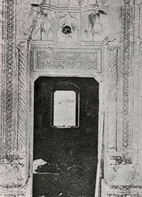 Portal with cable columns, inscription and muqarnas hood