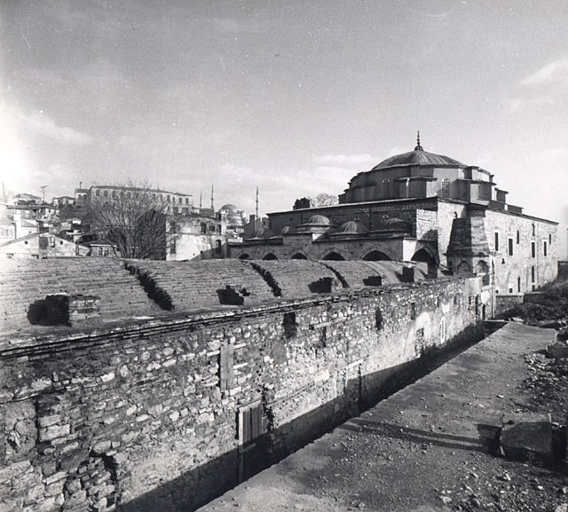 Exterior view from west showing exterior wall of the southern zawiya wing and mosque with collapsed minaret