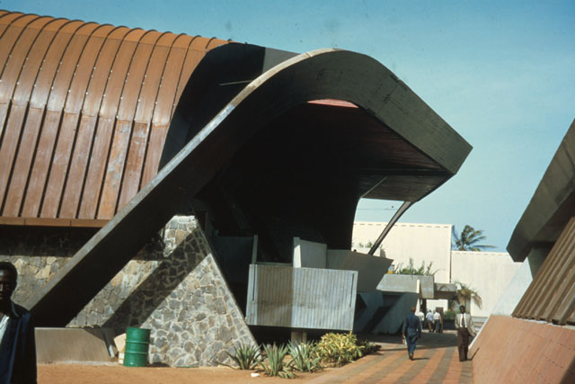 Exterior view showing corrugated roofs and paths between buildings