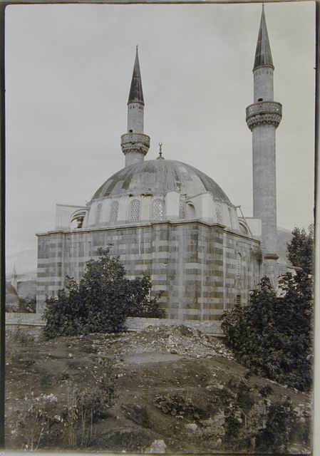 Exterior view of mosque from south-southwest, showing qibla wall and buttressed prayer hall dome
