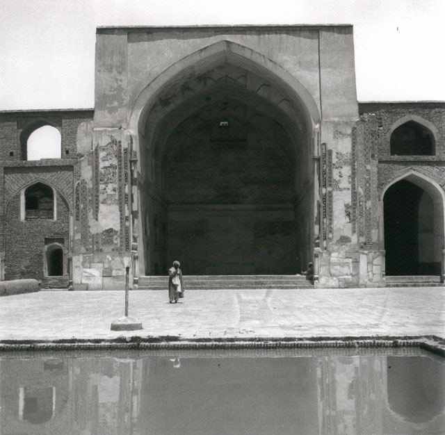 View of courtyard, showing north iwan with pool in foreground