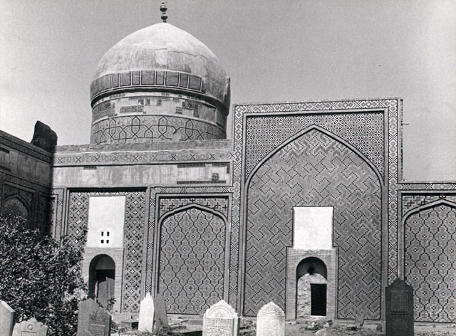 Exterior view of Firuzshah Madrasa, showing front elevation with green dome known as Gunbad-i Sabz