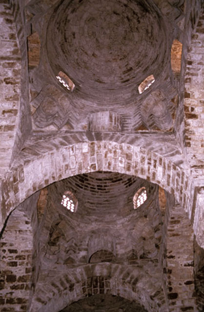 Interior view looking up at domical vaulting of the nave