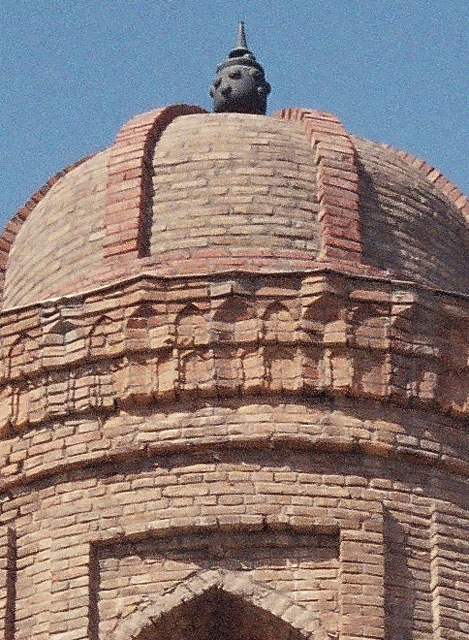 Detail of the minaret cupola and muqarnas cornice