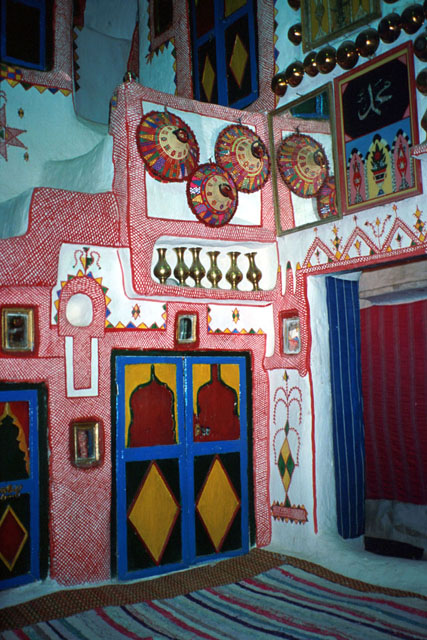 Interior view showing built in display areas and ornate wall painting